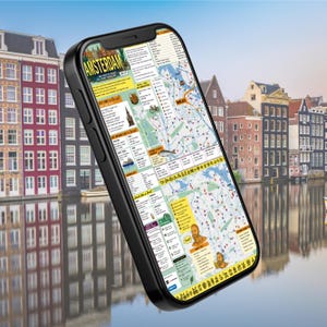 May include: A black smartphone displaying a detailed digital map of Amsterdam. The screen shows various sections including 'Act like a local', 'Get around like a local', and 'Drink like a local', featuring colourful icons, text, and a city street grid.