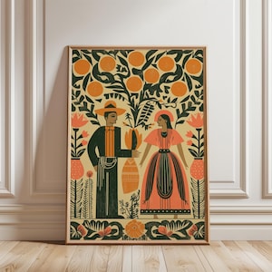 May include: A framed art print with a folk art style illustration of a couple under an orange tree. The artwork uses orange, green, and cream colours. The man wears a hat and suit, the woman a dress. Floral elements surround the figures, creating a decorative border.