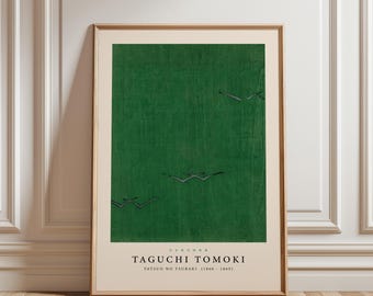 May include: Framed art print featuring a green background with several stylized birds in flight. The print includes the name "TAGUCHI TOMOKI" and "TATSUO NO TSUBAKI (1860 - 1869)" in black text at the bottom. The frame is a light brown color.