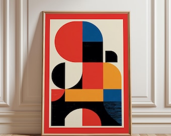 May include: Abstract geometric art print in a wooden frame. The artwork features a bold design with red, black, blue, and yellow shapes on a cream background, framed by a red border. The print is displayed against a white wall and wooden floor.