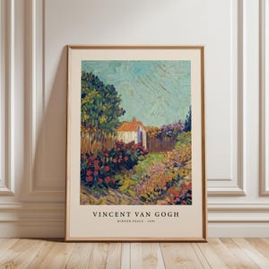May include: Framed art print of a Vincent Van Gogh painting, featuring a garden scene with a white building, red roof, and vibrant flowers. The artwork is titled "Hidden Peace - 1890" and is displayed in a wooden frame.