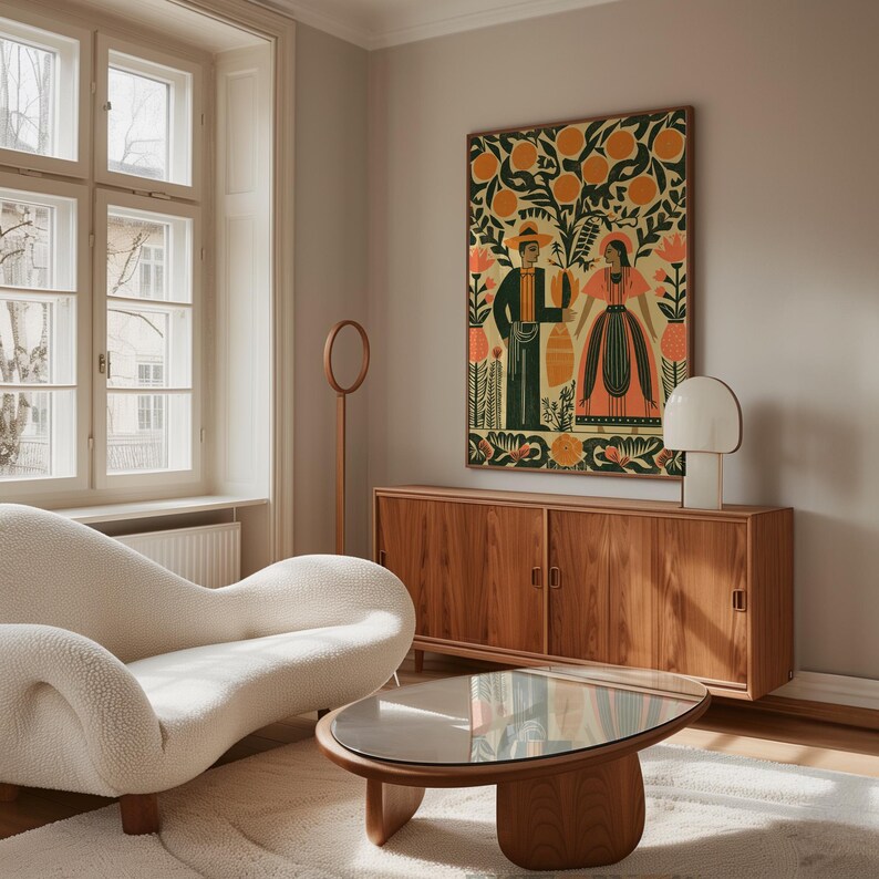 May include: A living room interior with a cream sofa, wooden coffee table, and a wooden cabinet. A large framed artwork in a folk art style, showing two figures and orange trees, hangs above the cabinet. A modern lamp and a circular floor lamp are also visible.