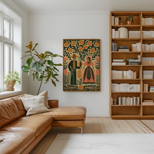 May include: A framed folk art print showing a man and woman in traditional dress, set against orange trees and floral elements. The artwork uses a warm colour palette with orange, green, and beige, creating a rustic and inviting aesthetic.