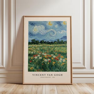 May include: A framed print of Vincent van Gogh's "Spring Meadow - 1890." The artwork depicts a vibrant field of wildflowers under a swirling, starry sky with crescent moons. The print is in a wooden frame.