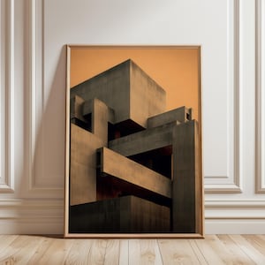 Könnte beinhalten: Gerahmter Kunstdruck mit einer komplexen, geometrischen Betonstruktur. Das Kunstwerk zeigt eine Reihe von miteinander verbundenen, eckigen Formen in Grau- und Brauntönen vor einem orangefarbenen Himmel. Der Druck ist in einem Holzrahmen ausgestellt.