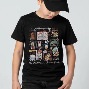 May include: Black t-shirt featuring a colorful collage of Disney characters and landmarks. The design includes Mickey Mouse, Minnie Mouse, Donald Duck, and Chip and Dale, with the text "Walt Disney World" and "2026 The Most Magical Place on Earth."