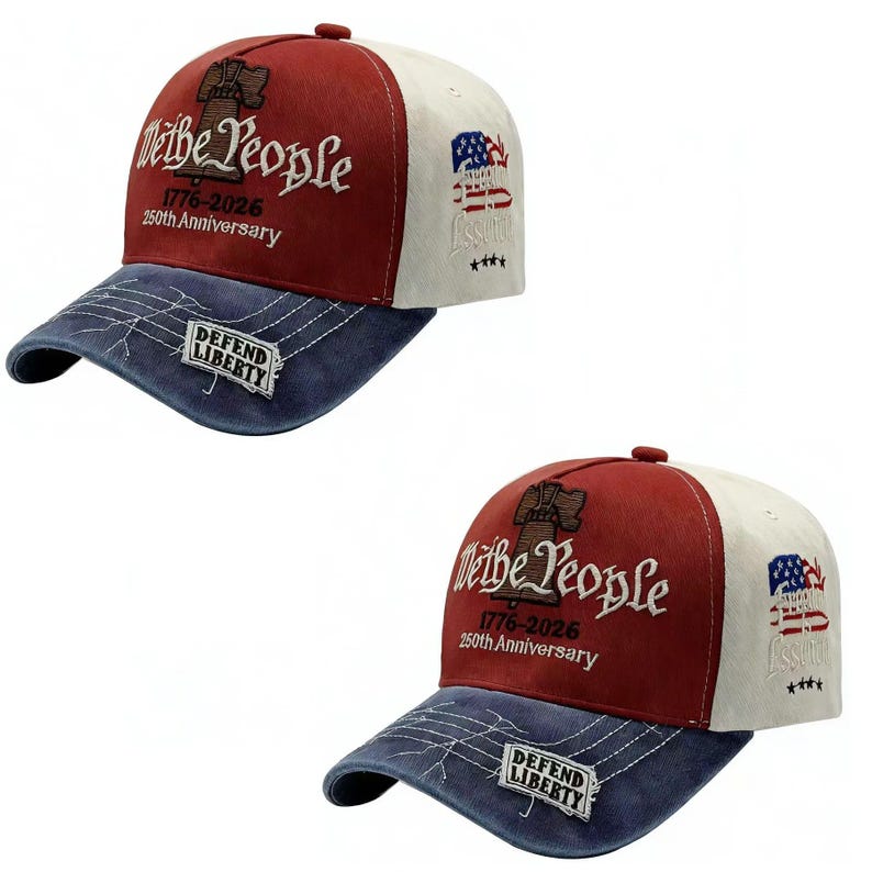 May include: Two baseball caps with patriotic designs. The caps feature a red crown, white side panels, and a blue brim. The front displays "We the People" and "1776-2026 250th Anniversary" in white embroidery. The brim has "DEFEND LIBERTY".