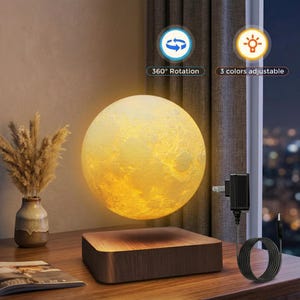 May include: A levitating moon lamp with a textured surface, emitting a warm glow. The lamp hovers above a wooden base. The image includes text that says "360° Rotation" and "3 colors adjustable".