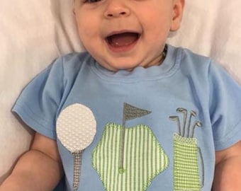 Cute Baby Blue Golf Romper featuring precious golfing trio applique design.  A must have for that perfect sport outfit!