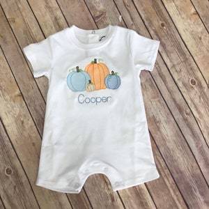 The cutest Pumpkin Sketch design on White Romper. A must have for this fall season!!