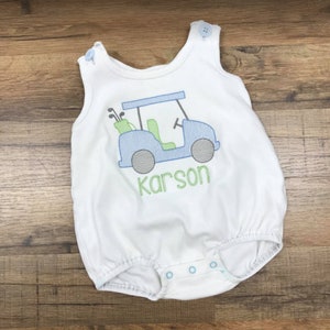 Cute White Bubble featuring a precious golf cart applique design.