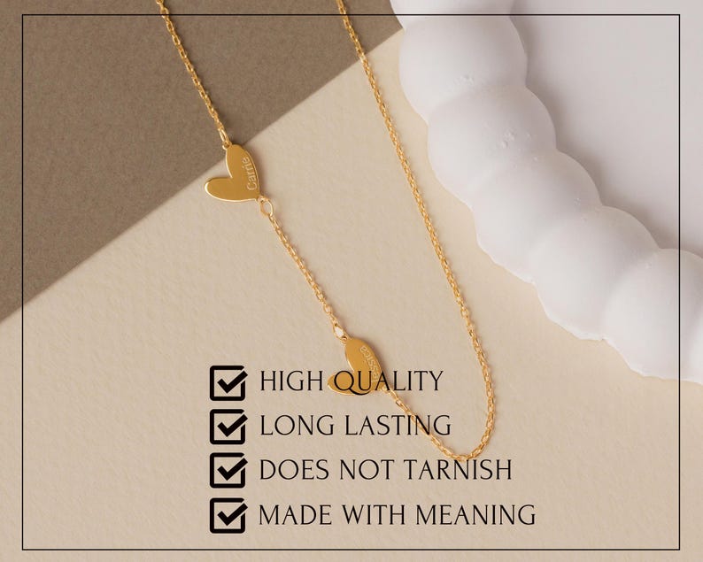 May include: A gold-colored chain necklace featuring two small heart-shaped charms, each engraved with a name. The image includes the text: HIGH QUALITY, LONG LASTING, DOES NOT TARNISH, MADE WITH MEANING, accompanied by four checkmark icons.