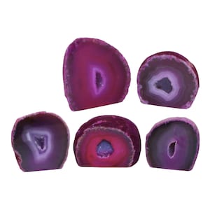 May include: Five polished agate slices in shades of purple and magenta. Each slice reveals a crystalline center, with variations in color intensity. The stones are cut to display their natural patterns and textures, showcasing the beauty of the mineral.