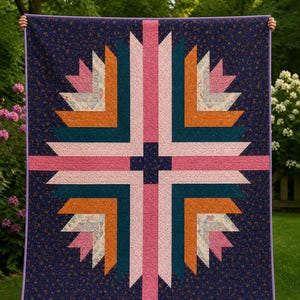 May include: A rectangular quilt featuring a central cross design composed of geometric strips in shades of pink, orange, teal, and floral patterns. The background is a dark navy blue fabric with a small gold star print, finished with a purple border.