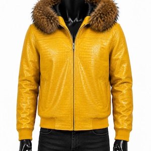 May include: A yellow leather jacket with a fur-lined hood. The jacket has a textured pattern, a zipper closure, and ribbed cuffs and hem. The jacket is displayed on a black mannequin.