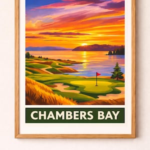 May include: Framed art print of Chambers Bay golf course at sunset. The image features a vibrant sky with orange, yellow, and purple hues. The golf course is green with a red flag on the green. The text "CHAMBERS BAY" is at the bottom.
