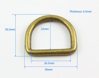 May include: A gold-toned metal D-ring with measurements: 30.5mm, 22mm, 26.5mm, 36mm, and 4.5mm.  Thickness: 4.5mm