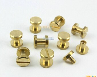 May include: Ten brass thumbscrews with a slotted head. The thumbscrews are approximately 2.5 cm in length.