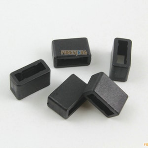 May include: Five black plastic rectangular buckle keepers with a rectangular opening in the centre.