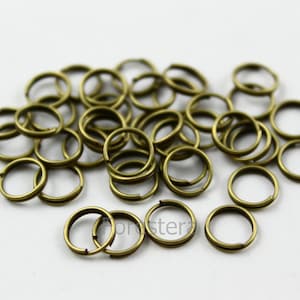 100 st 7 mm antikmässing dubbelögla öppna hoppringar mässingspläterade O-ringar (PND136)