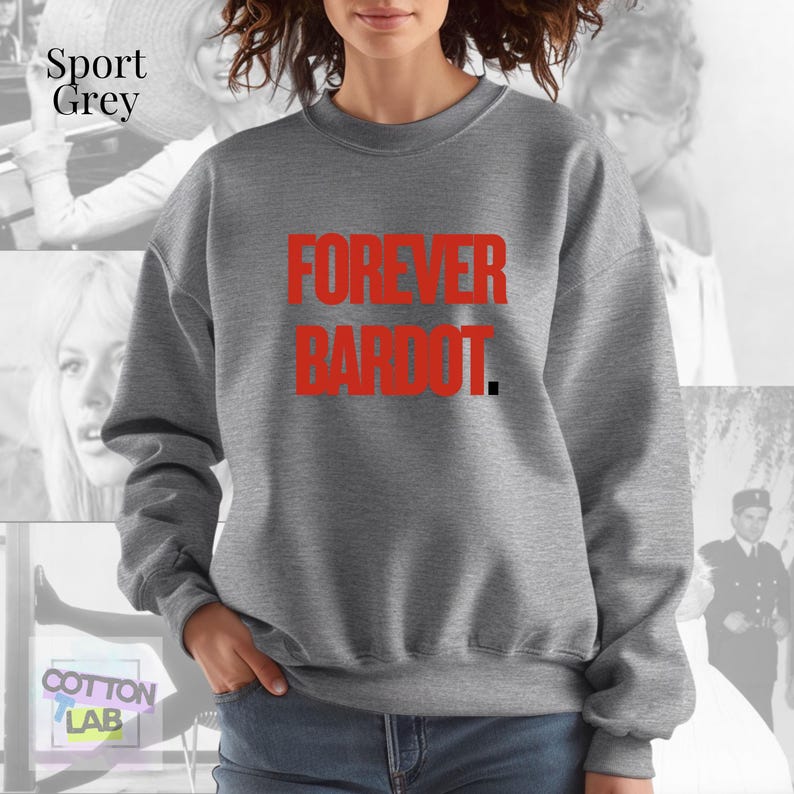May include: Sport grey sweatshirt with the text "FOREVER BARDOT" in red. The sweatshirt is a neutral color and has a crew neck. The text is in a bold, sans-serif font. The background features a collage of images.