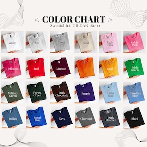 May include: Color chart of Gildan 18000 sweatshirts in various colors. The chart includes White, Ash, Sport Grey, Sand, Light Pink, Safety Pink, Heliconia, Red, Maroon, Gold, Irish Green, Military Green, Forest Green, Dark Chocolate, Purple, Light Blue, Carolina Blue, Indigo, Royal Blue, Navy, Charcoal, Dark Heather, and Black.