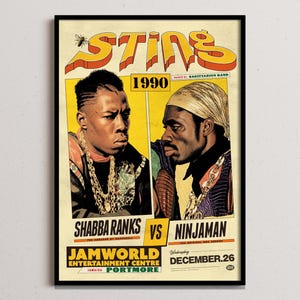 May include: A framed poster advertising the 1990 Sting concert featuring Shabba Ranks vs. Ninjaman. The poster has a vintage design with yellow, orange, and black text and illustrations of the artists. The concert was held at Jamworld Entertainment Centre in Portmore, Jamaica.