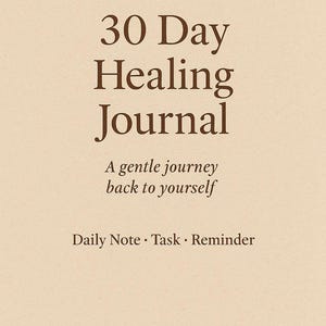 May include: A beige journal with the text "30 Day Healing Journal" in a dark brown serif font. The journal also includes the phrases "A gentle journey back to yourself" and "Daily Note &bull; Task &bull; Reminder."