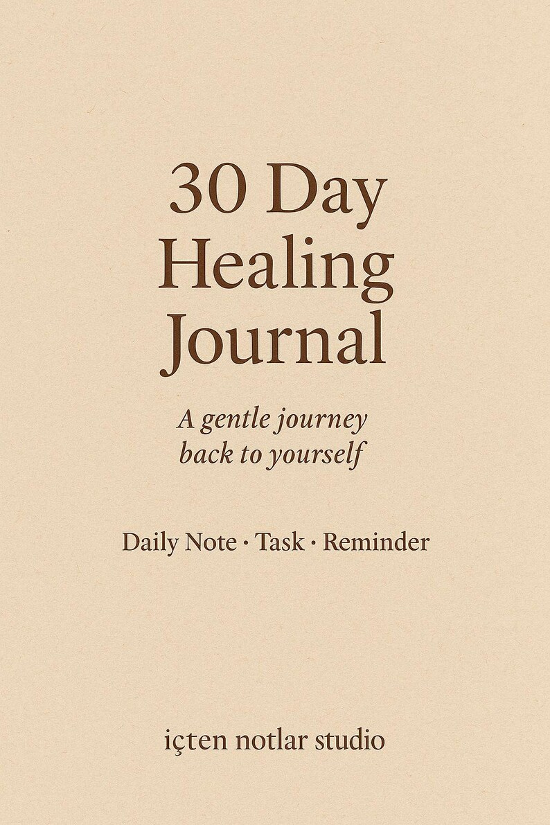 May include: A beige journal with the text "30 Day Healing Journal" in a dark brown serif font. The journal also includes the phrases "A gentle journey back to yourself" and "Daily Note &bull; Task &bull; Reminder."