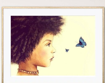 May include: A framed art print featuring a side profile of a person with dark curly hair, gazing at two blue butterflies against a pale yellow background. The person wears a beaded necklace. The artwork is in a light wood frame.
