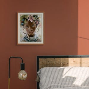 May include: A framed painting of a young woman with dark skin, wearing a floral crown and a necklace. She has large hoop earrings and is looking directly at the viewer.