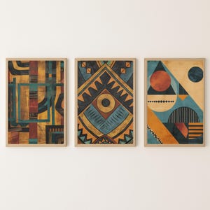 May include: Three framed abstract art prints. Each print features geometric designs in shades of teal, orange, yellow, and brown. The artwork has a vintage aesthetic, with a focus on shapes and patterns.