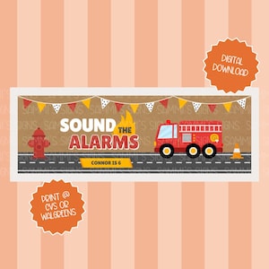 May include: A rectangular sign featuring a fire truck, a red fire hydrant, and an orange traffic cone on a road. The text reads SOUND THE ALARMS and CONNOR IS 6. Above, a string of red, yellow, and white polka dot pennant flags hangs across.