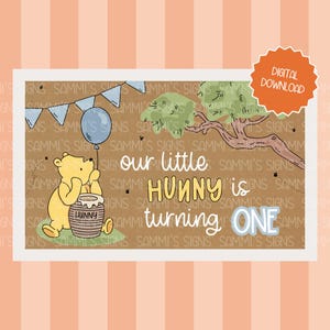 May include: A digital download featuring Winnie the Pooh. The illustration shows Pooh Bear with a honey pot, a blue balloon, and the text "our little Hunny is turning ONE." The design includes a tree and a banner.