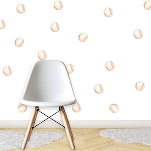 May include: A white molded plastic chair with four light wood legs and black metal supports, positioned in front of a wall decorated with numerous scattered watercolor-style baseball decals featuring white leather and red stitching.