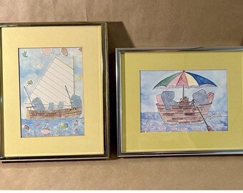 Lot of 2 Framed Susan Gantner Hippo Prints-Picnic by the Sea-Hippos in a Boat with an Umbrella