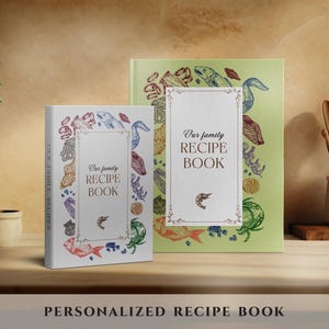 May include: Two recipe books with the text "Our family RECIPE BOOK". The book on the left is white with colorful illustrations of seafood and a shrimp. The book on the right is light green with similar illustrations. The bottom of the image reads "PERSONALIZED RECIPE BOOK".