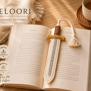 May include: A crochet sword bookmark featuring a brown handle, a mustard yellow crossguard, and a cream and grey blade. The bookmark includes a cream-coloured cord with a tassel at the end. The text FELOORI CROCHET PATTERNS is visible.