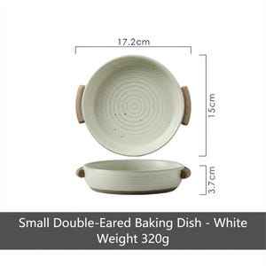May include: A white, small double-eared baking dish with a diameter of 17.2cm, a height of 15cm, and a depth of 3.7cm. The dish has wooden handles and a weight of 320g. The text on the image reads: "Small Double-Eared Baking Dish - White Weight 320g."
