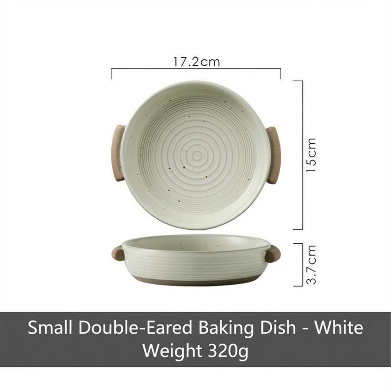 May include: A white, small double-eared baking dish with a diameter of 17.2cm, a height of 15cm, and a depth of 3.7cm. The dish has wooden handles and a weight of 320g. The text on the image reads: "Small Double-Eared Baking Dish - White Weight 320g."