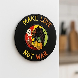 May include: Black circular magnet with the text "MAKE LOVE NOT WAR" in yellow and orange. It features a cartoon illustration of a person with dreadlocks, smoking, and wearing a yellow and green shirt.