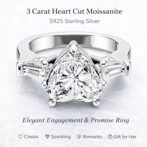 Puede incluir: Un anillo de compromiso de plata con una piedra central de moissanita en forma de corazón y piedras laterales de baguette. El anillo está etiquetado como "3 Carat Heart Cut Moissanite" y "Elegant Engagement & Promise Ring".