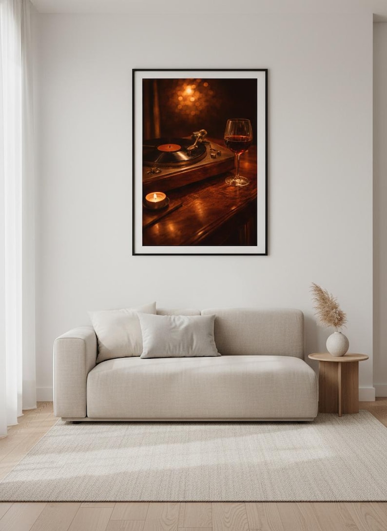 May include: A framed print showing a vintage record player with a vinyl record, a glass of red wine, and a lit candle on a wooden surface. The image has a warm, inviting ambiance, suggesting a cosy, relaxed setting.