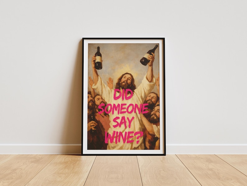 A framed funny altered art poster of Jesus holding two wine bottles with the neon pink text 'Did Someone Say Wine?', perfect for eclectic kitchen or home bar decor.