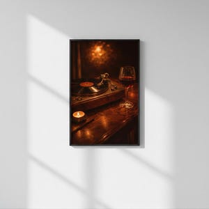 May include: A framed picture showing a vintage record player with a vinyl record, a lit candle, and a glass of red wine. The scene is set on a dark wooden surface, creating a warm atmosphere. The lighting suggests a cosy, intimate setting.