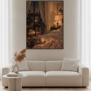 May include: A framed wall art print depicting a cozy bedroom scene at night with a glass of wine, a small vase of flowers, a candle, and an open book on a bed, set against a window view of a city skyline with warm indoor lamp lighting.