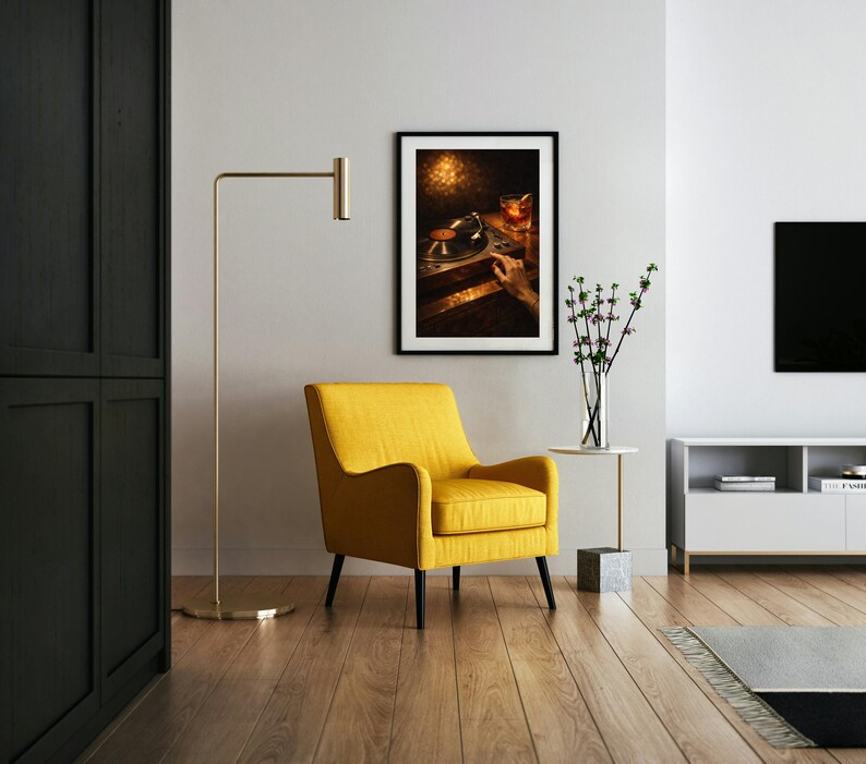 May include: A contemporary living room featuring a yellow armchair, a gold floor lamp, and a framed picture of a record player. The room has wooden flooring and a white side table with a vase of flowers.