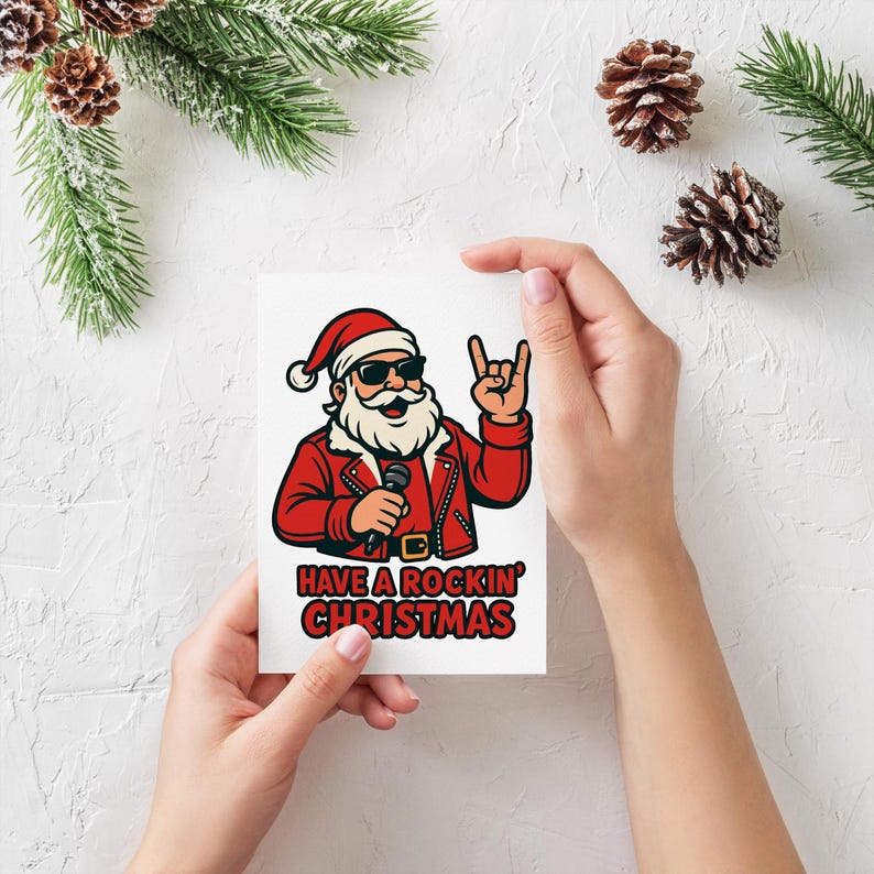 K&ouml;nnte beinhalten: Wei&szlig;e Weihnachtskarte mit einer Cartoon-Illustration von Santa Claus mit Sonnenbrille und roter Jacke, der ein Mikrofon h&auml;lt und das Rock'n'Roll-Handzeichen zeigt. Der Text "HAVE A ROCKIN' CHRISTMAS" ist darunter gedruckt.