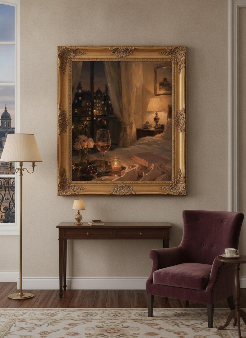 May include: A large, ornate gold-framed painting depicting a cozy bedroom scene at night, featuring a glass of wine, a small bouquet of flowers, a lit candle, and an open book on a bed, with a city view visible through a window in the background.