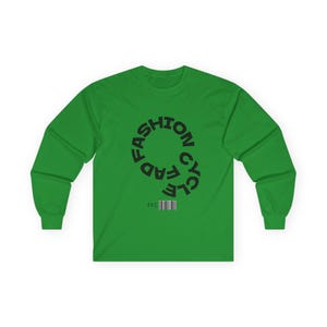 May include: A long-sleeve green shirt with the words "FASHION CYCLE" in a circular design. The shirt also features the letters "FFC" and a barcode. The shirt is made of a soft, comfortable material.